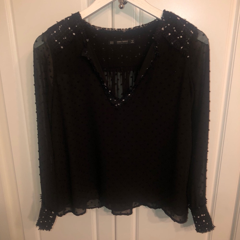 Black blouse with tweed detailing and sheer sleeve